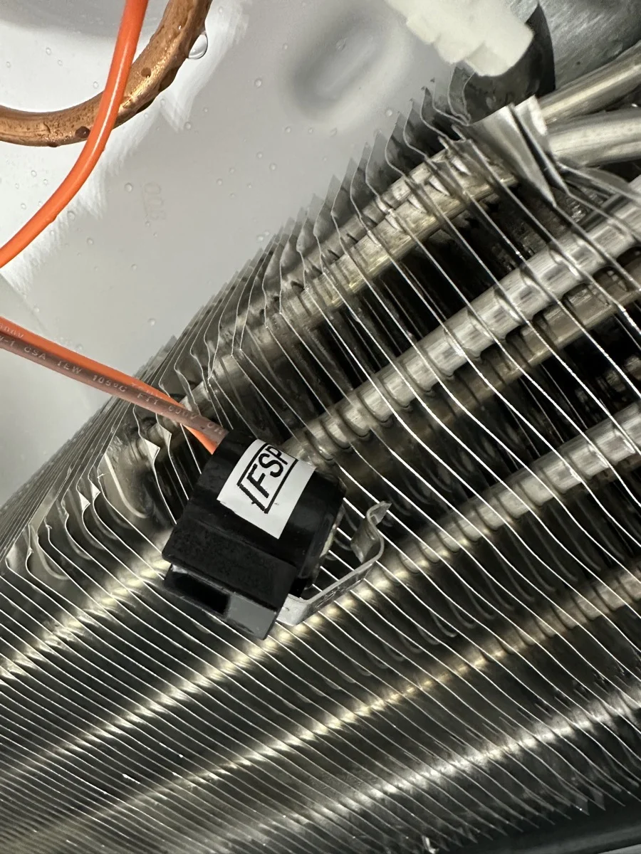 Professional refrigerator repair service for defrost thermostat failure